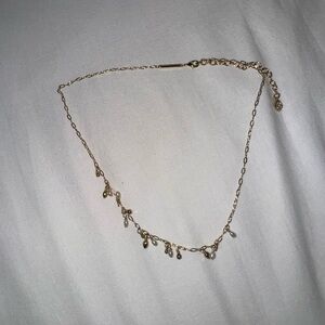 Elegant Gold Necklace with Dangle Charms